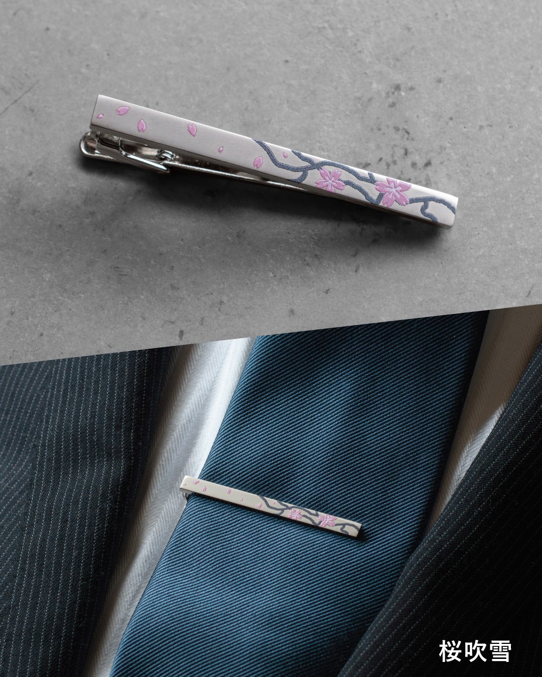 「桜吹雪」モデル。上品なベージュをベースに、風に舞うピンクの桜の花びらと枝を描いた和モダンなネクタイピン。春の装いやお祝いの席にふさわしい華やかな着用イメージ。